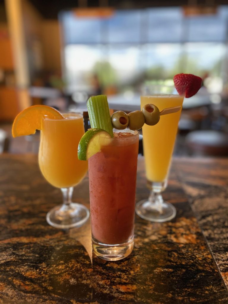 Image of a beermosa, bloody mary, and mimosa during brunch at World of Beer