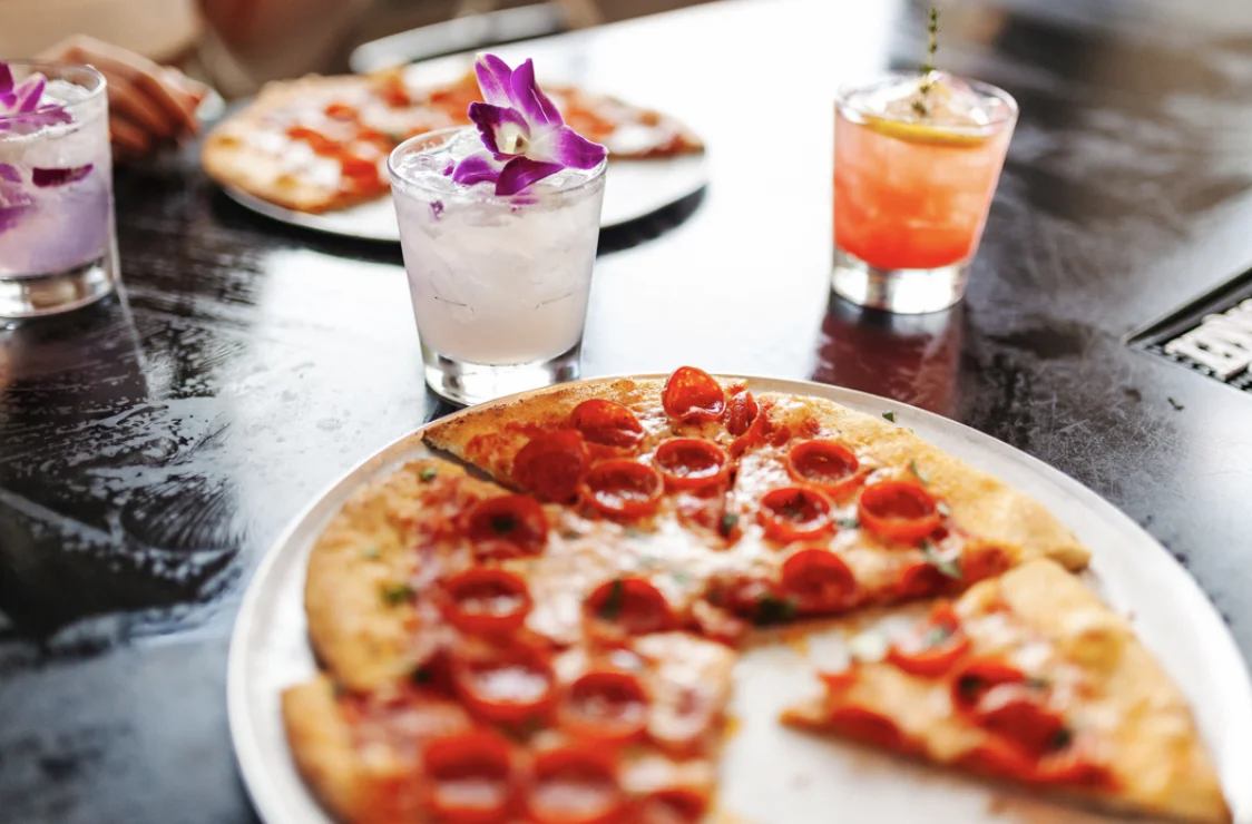 Oak & Stone offers gluten-free pizza crust and vegan cheese on the menu