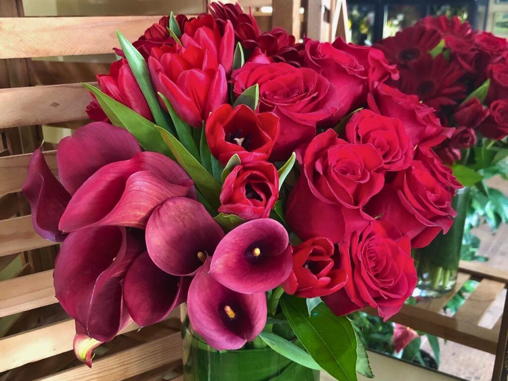 Image of a red and pink bouquet of flowers by Green Bench Flowers