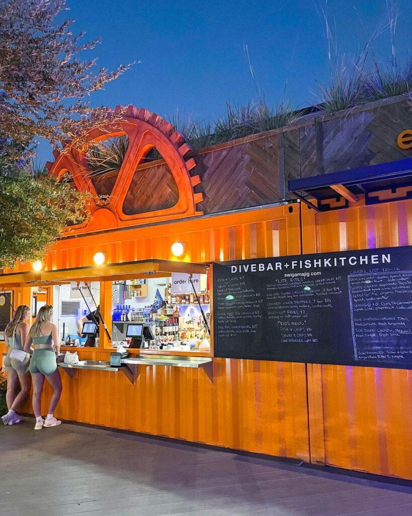 bright orange shipping container Sparkman Wharf Restaurants edisons swigamajig @edisons_swigamajig