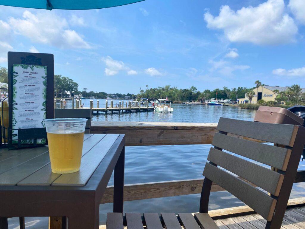 Waterfront table with drink at Crump's Landing Homosassa Florida