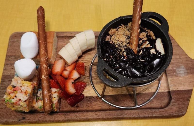 Dessert Chocolate Fondue at Melting Pot Social with bananas, strawberries, marshmallows, pretzel rods and more