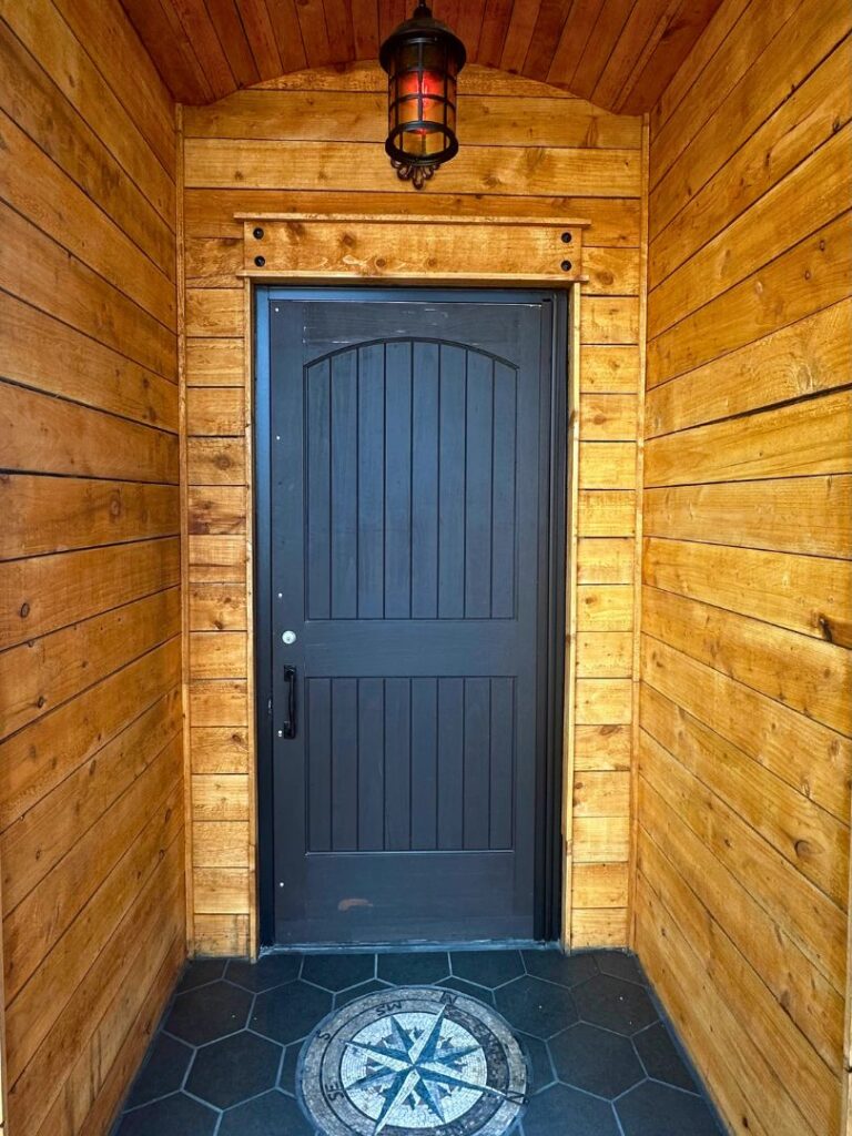 Morgan's Cove entrance - wooden door and red light