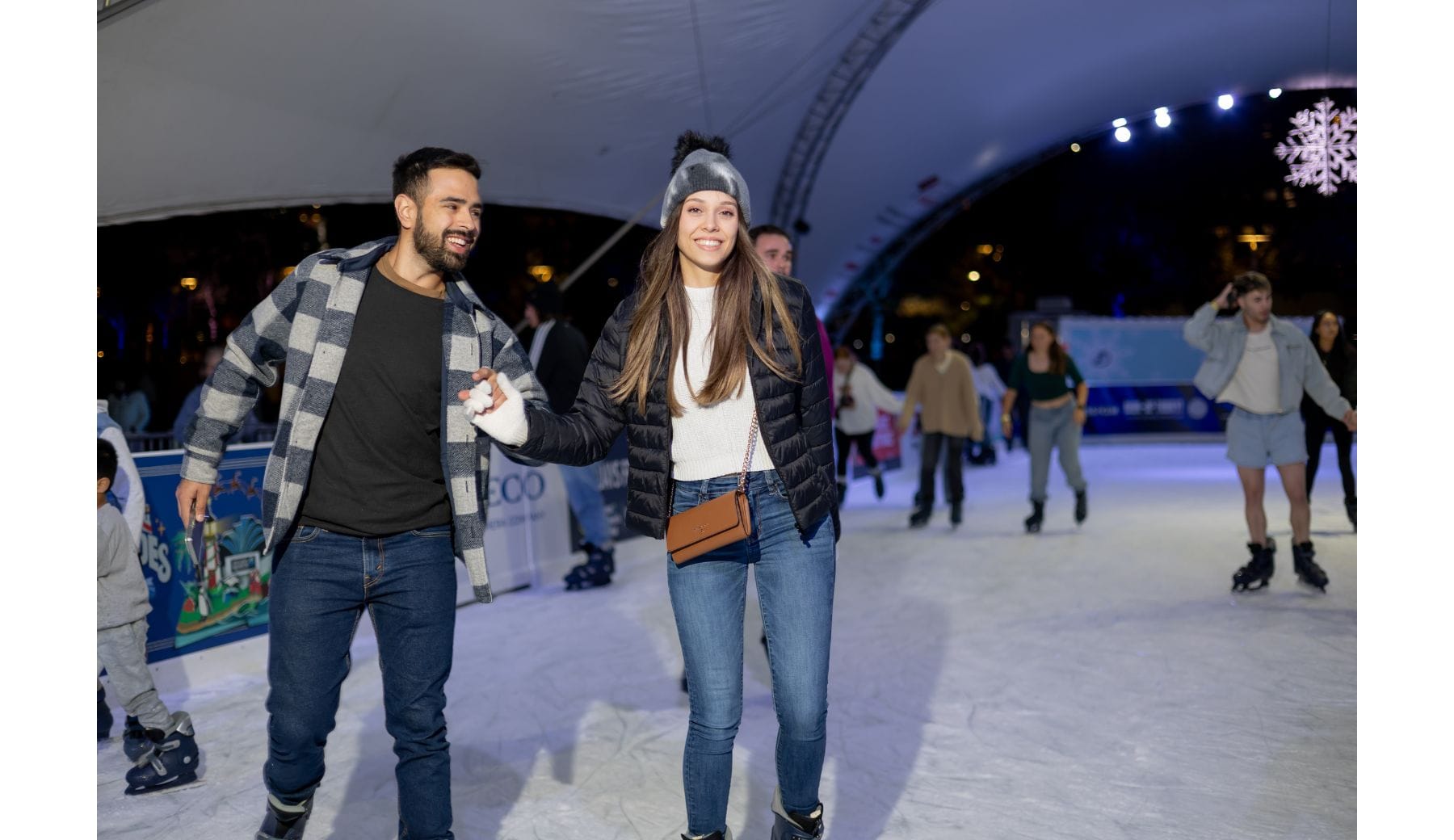 Couple skating at Winter Village 2024 — Image by Winter Village
