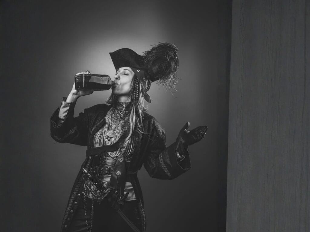 Vika_Glitter from pixabay Gasparilla drinking woman in full pirate garrb in black and white