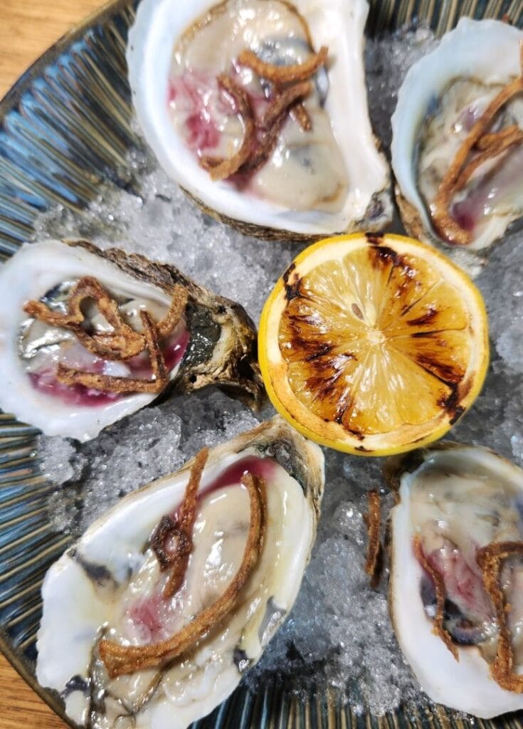 oysters on crushed ice with chared lemon