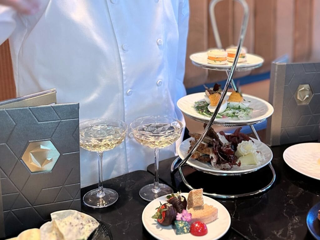 GEO-82 Adults Only Lounge at EPCOT Chef James explains menu for fireworks experience - image by Dani Meyering