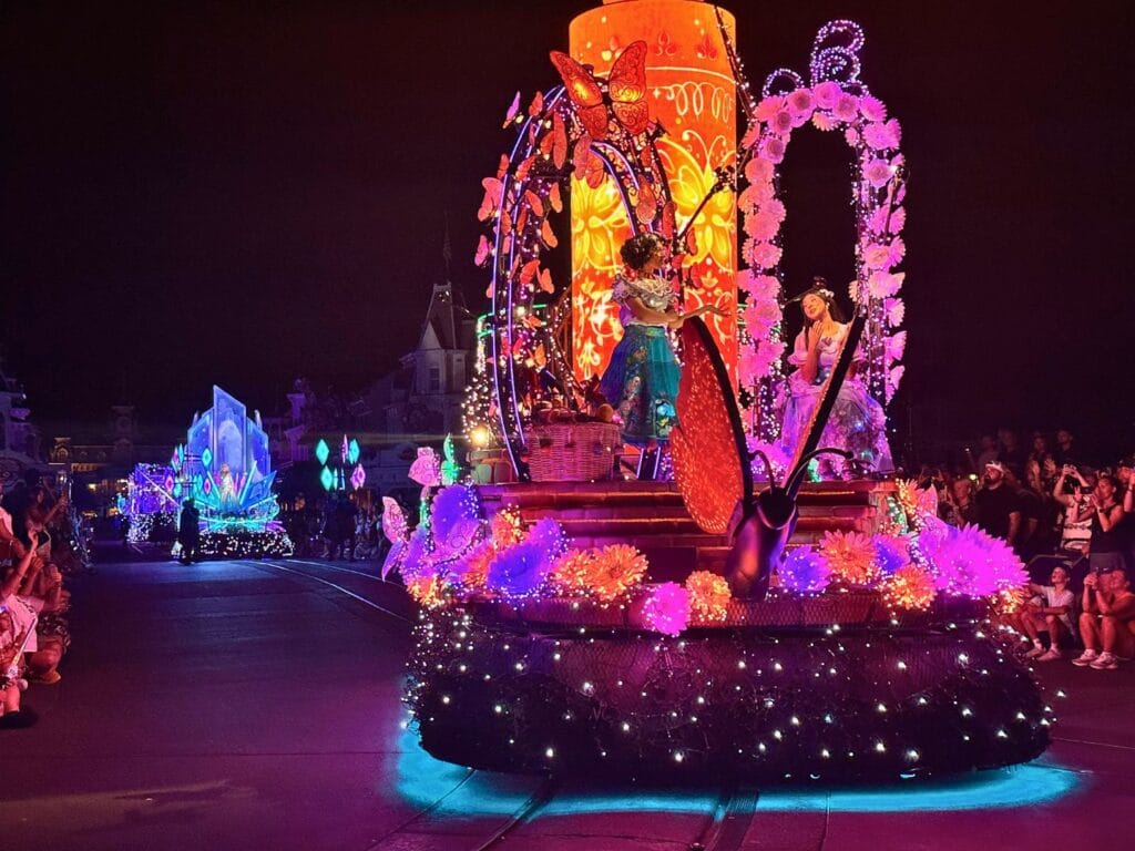 Mirabel and Isabella Encanto Float followed by Frozen float on Main Street Disney Starlight - image by Dani Meyering 2