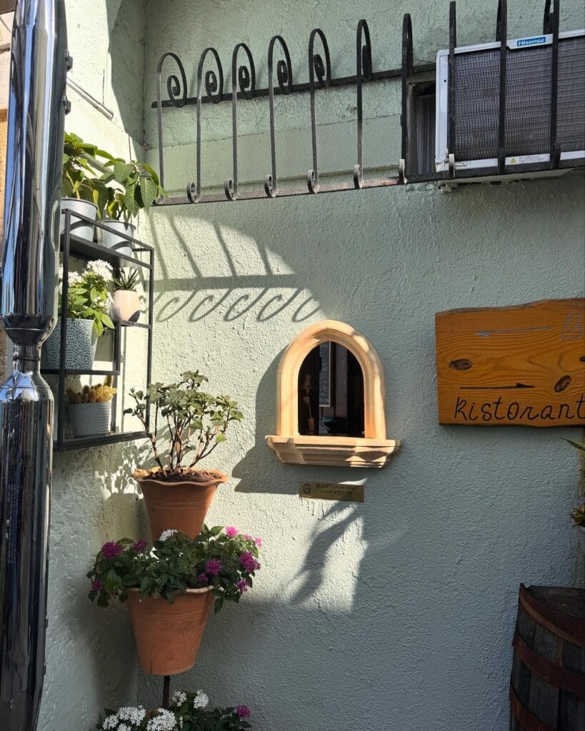 Oggi Spritz Bar Wine Window Tampa Bay with flowers and sign - @oggitalian