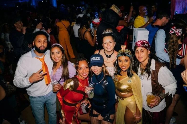 People dressed up in costumes for Yacht StarShip's Halloween Rock the Bay 2024