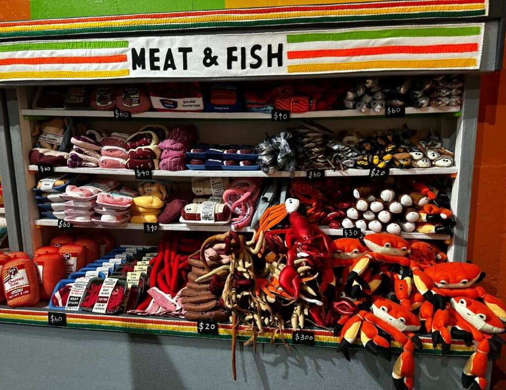 The Meat & Fish Section of Lucy Sparrow's Quick Shop with crab, lobster, fish, meats, and sausages!