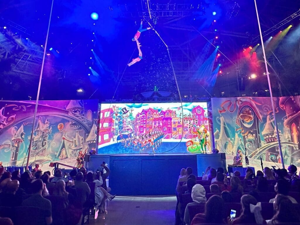 Acrobats in air during Pomp, Snow, and Cirqueumstance at Gaylord Palms - image by Dani Meyering
