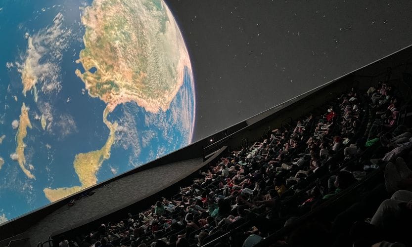 A packed house inside of MOSI's Saunders Planetarium