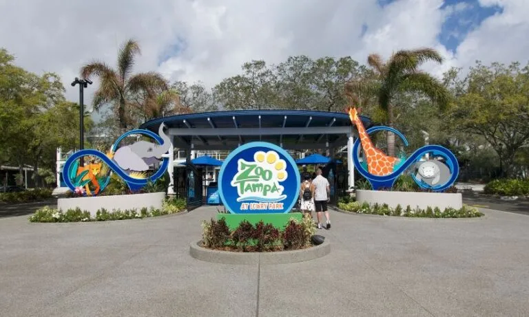 ZooTampa entrance sign featuring an elephant, giraffe, manatee, and more!