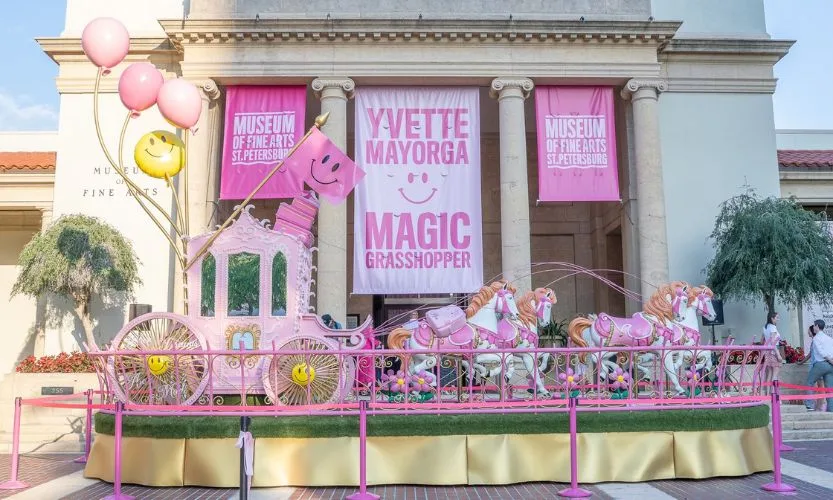 A 30-foot long house and carriage sculpture by Yvette Mayorga outside of the Museum of Fine Arts in St. Pete Florida