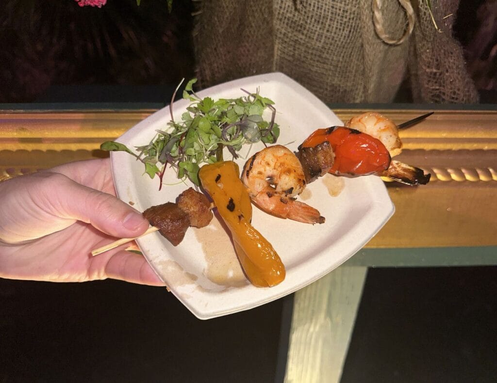 a shrimp and pork skewer in front of a cute picture frame photo op