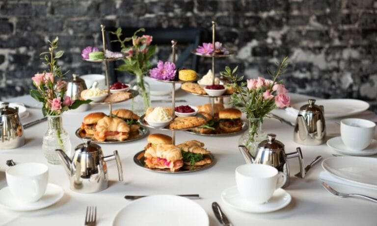 A spread featuring various pastries and tea tableware for tea service in Tampa Bay