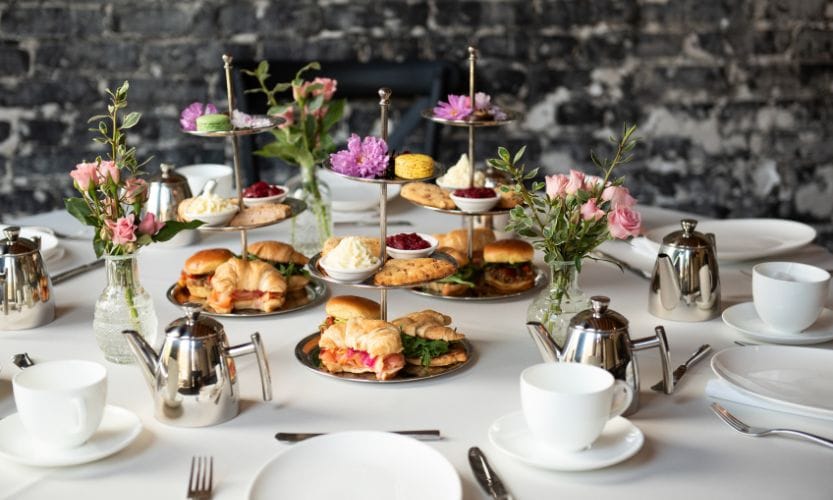 A spread featuring various pastries and tea tableware for tea service in Tampa Bay